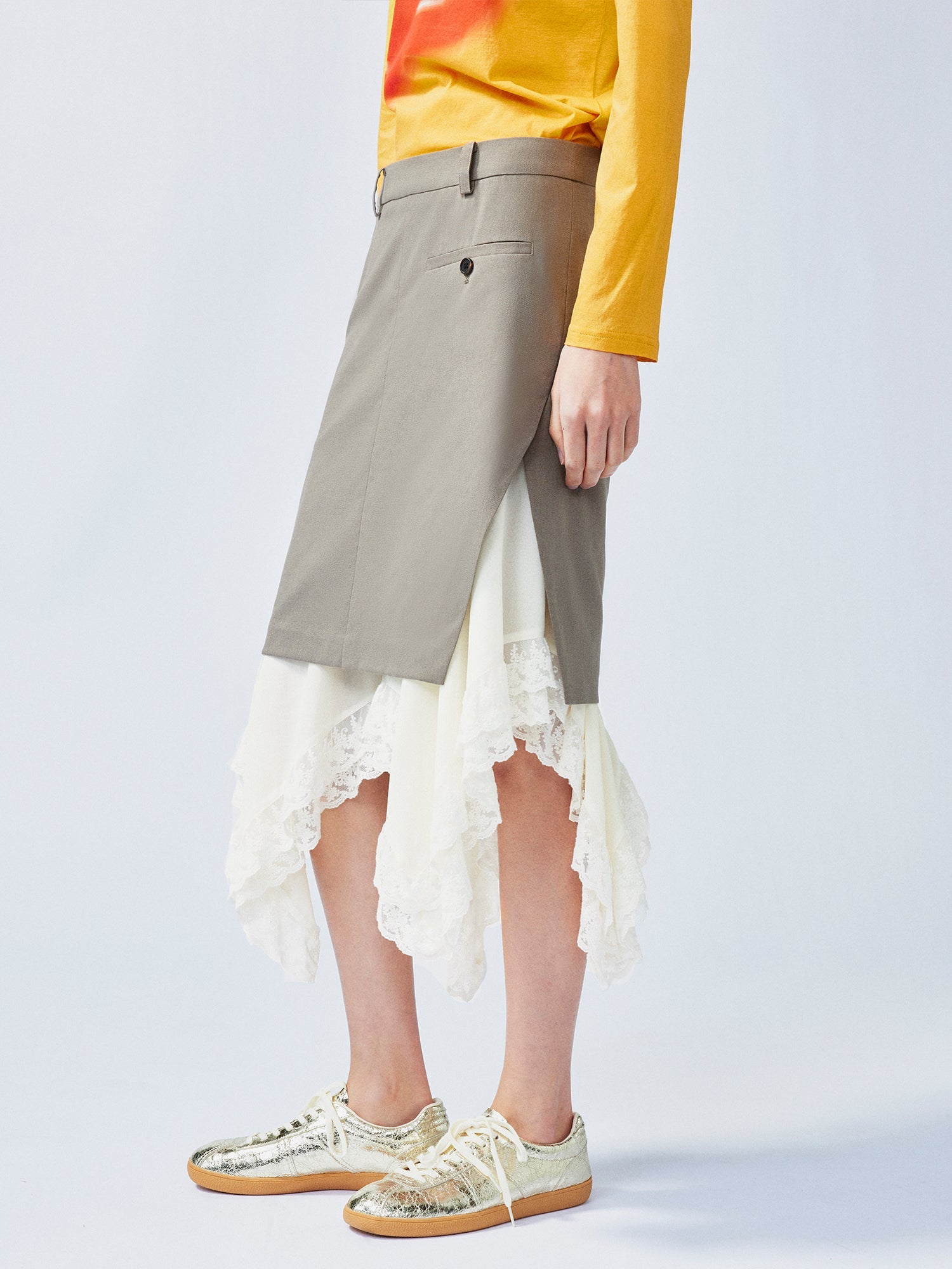 A misaligned suit layered-look skirt