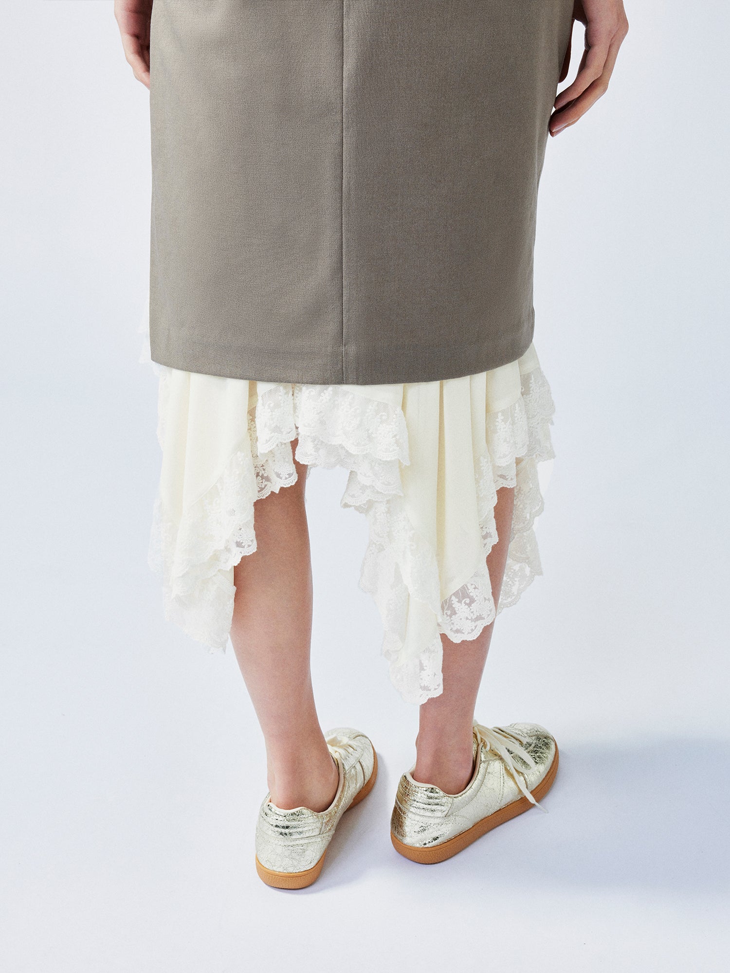 A misaligned suit layered-look skirt