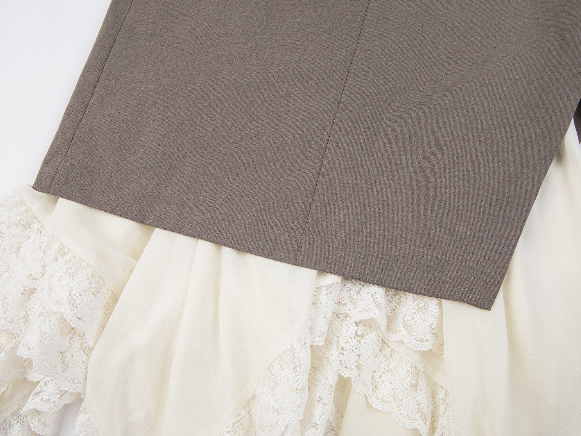 A misaligned suit layered-look skirt