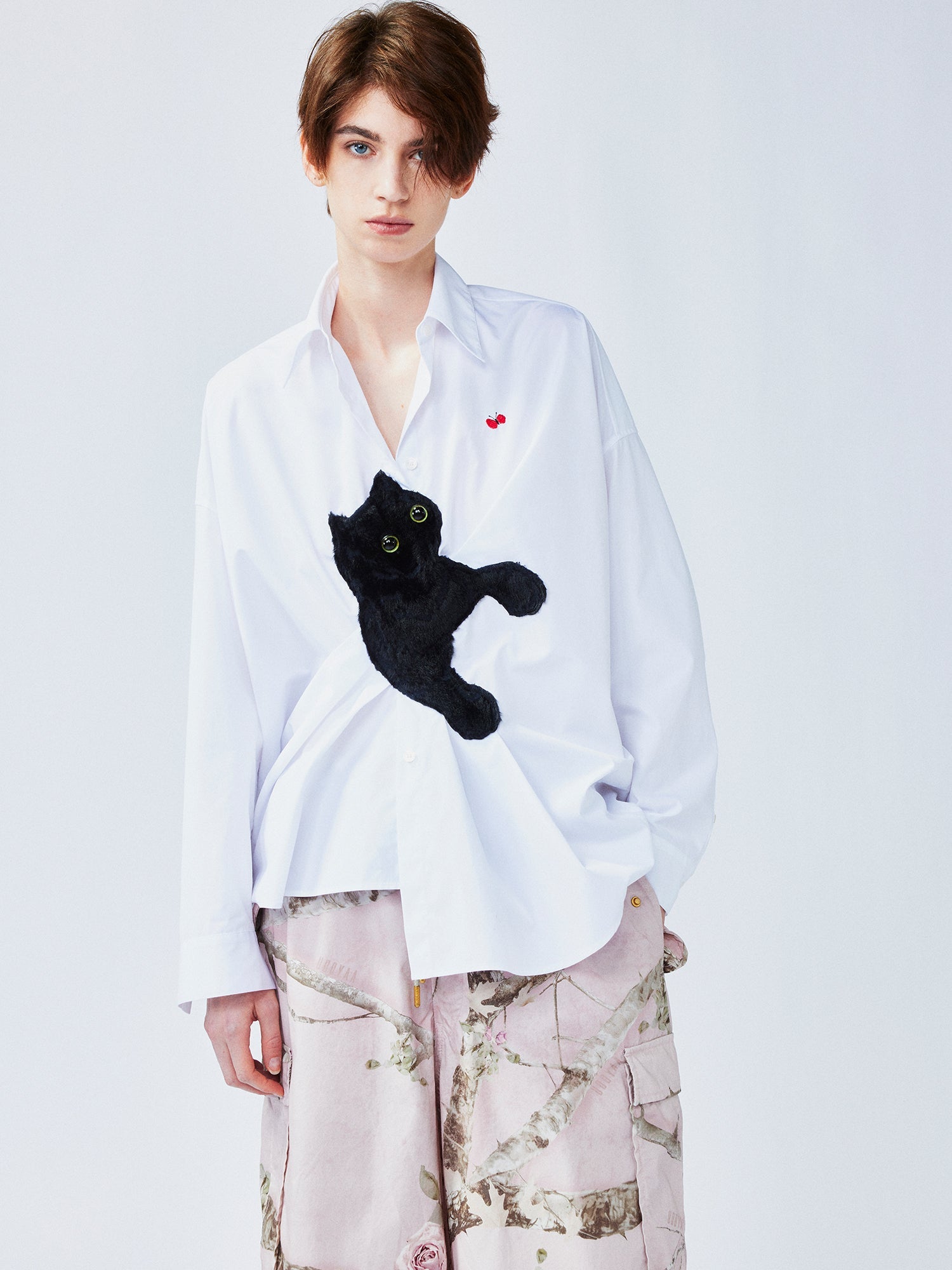 Playful cat chasing butterfly shirt