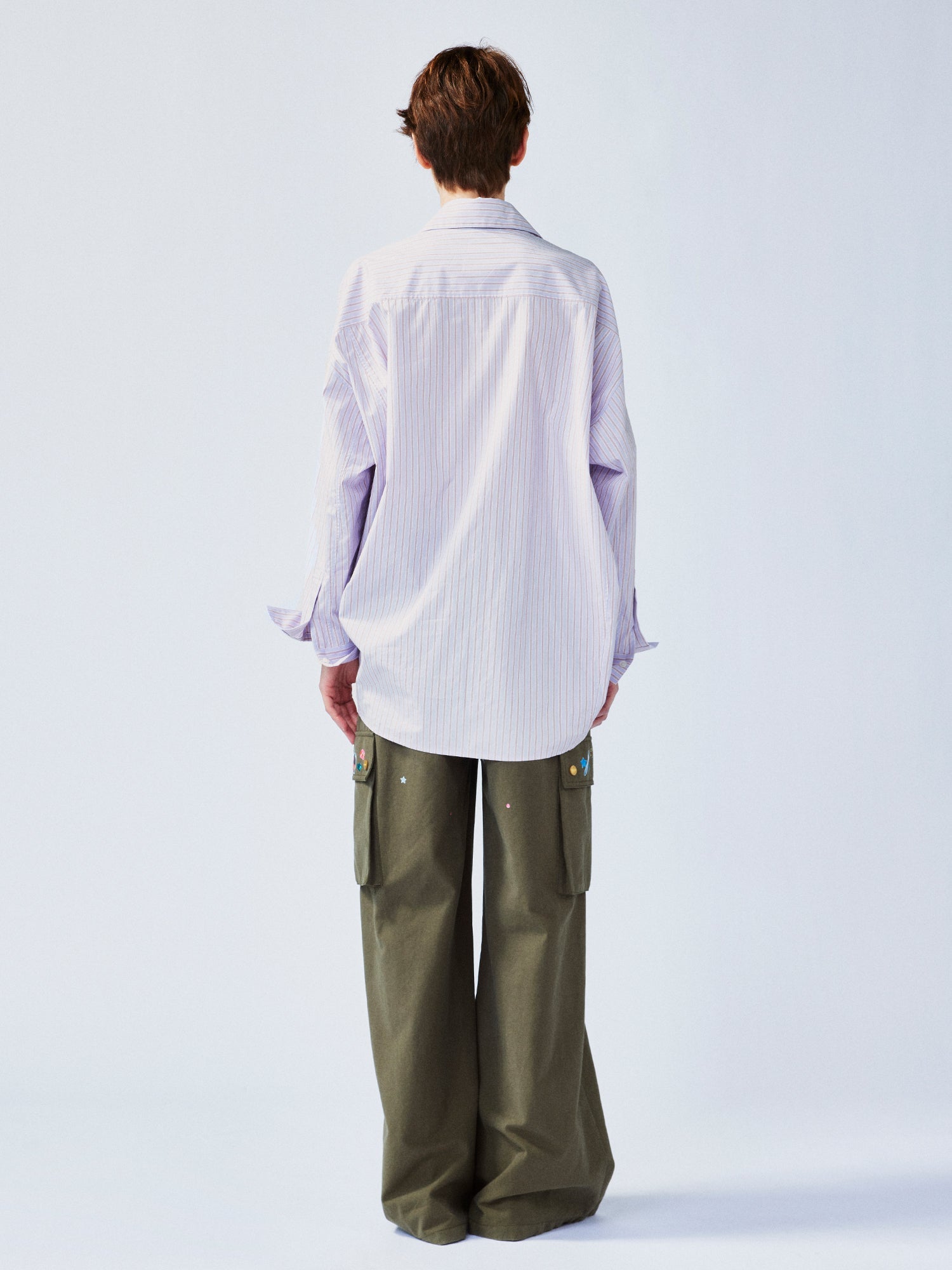 Playful puppy biting shirt