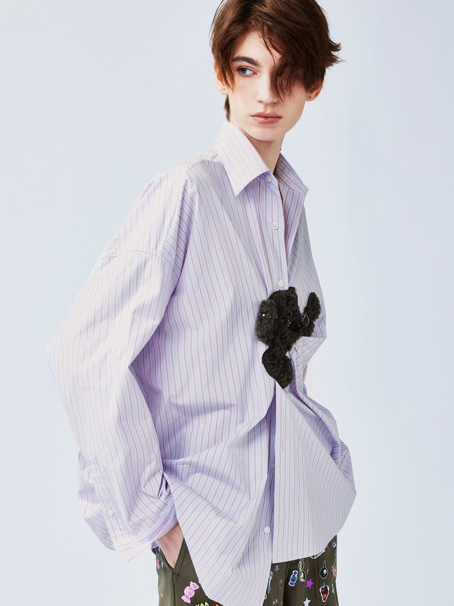 Playful puppy biting shirt