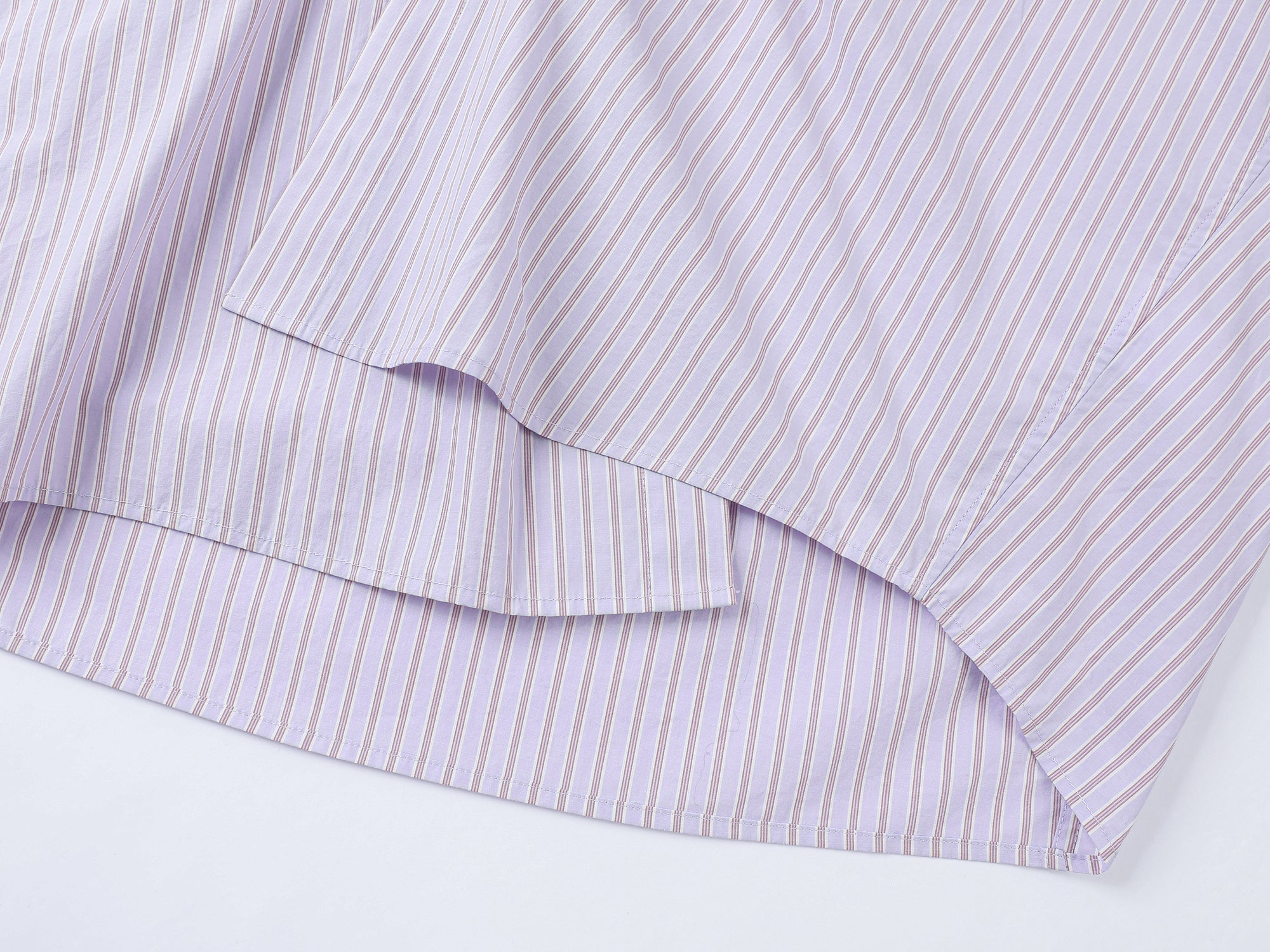 Playful puppy biting shirt