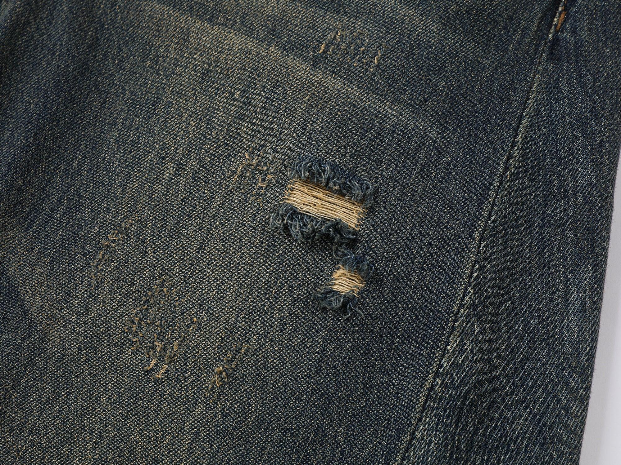 Wardrobe essential distressed wash scythe-cut jeans