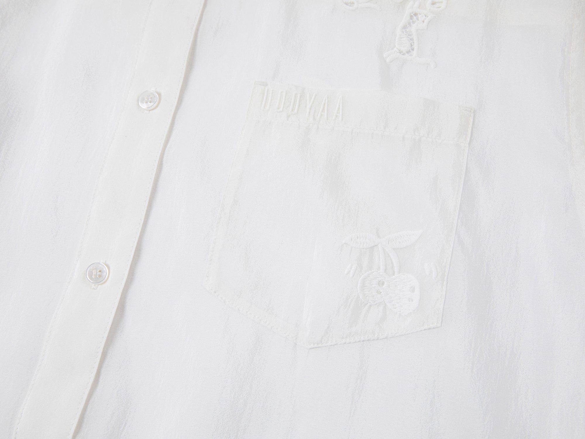 Embroidered cutout hooded shirt