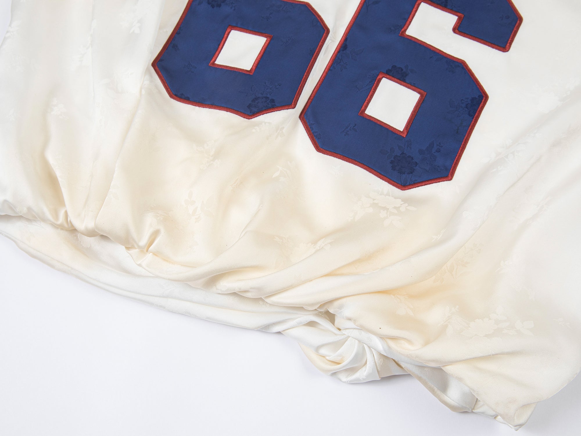 Distressed satin tulip jersey