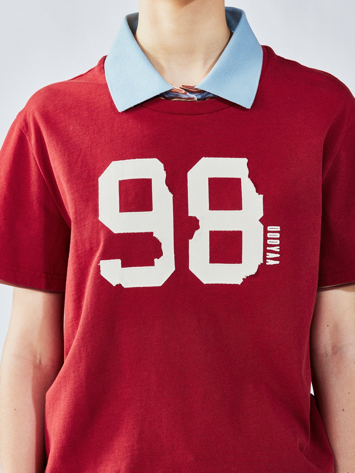 Faux two-piece polo tee