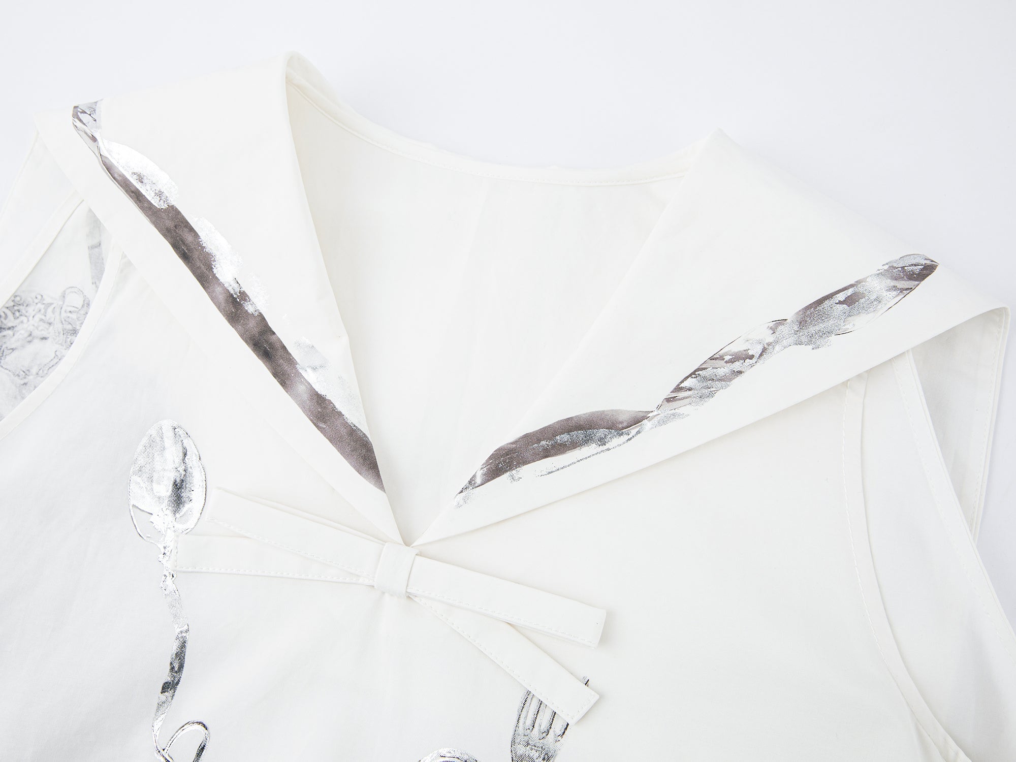 Sailor tank dress with cutlery motif and silver foil