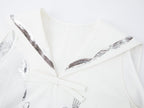Sailor tank dress with cutlery motif and silver foil