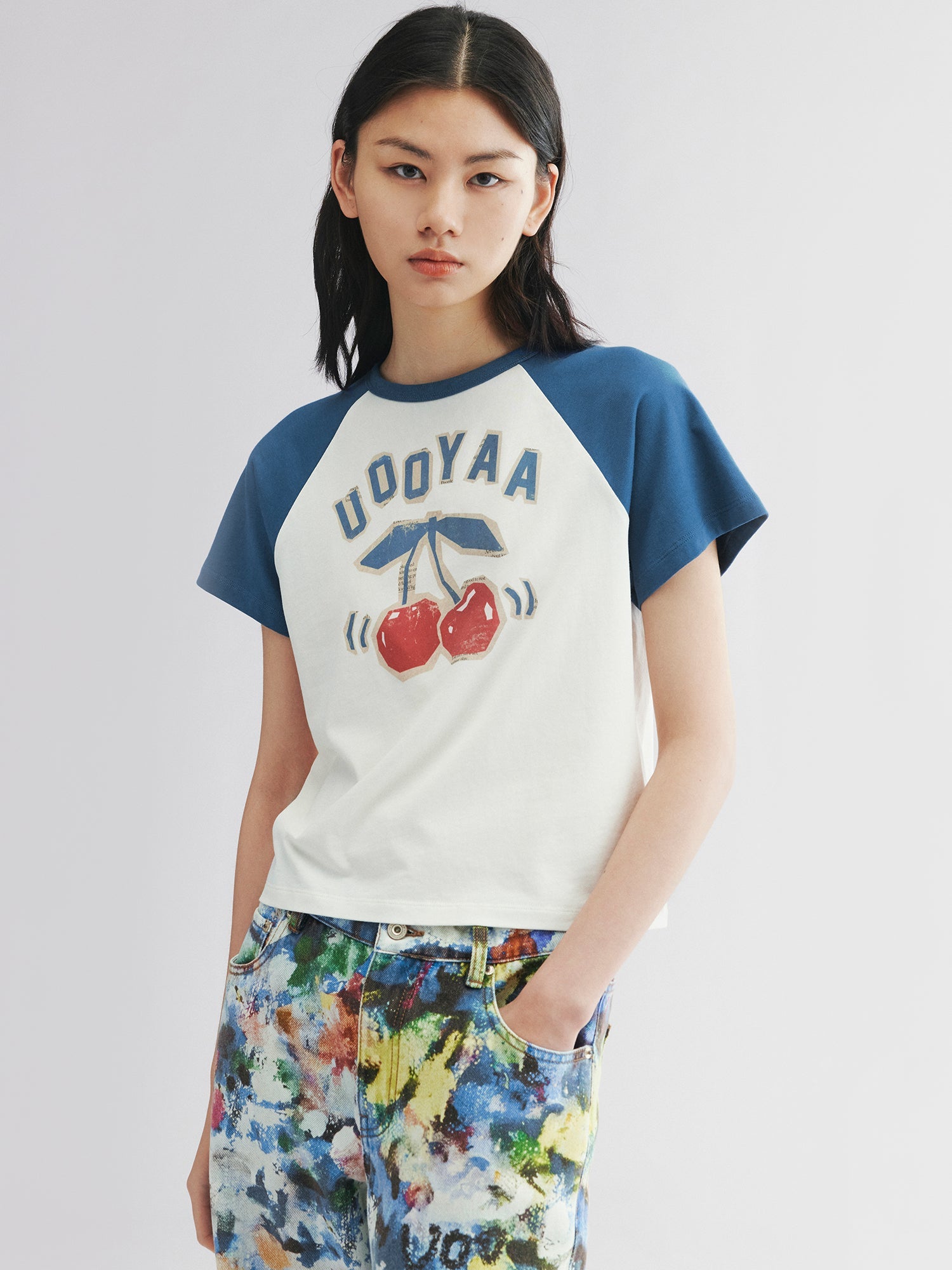Raglan sleeve tee with dynamic cherry print