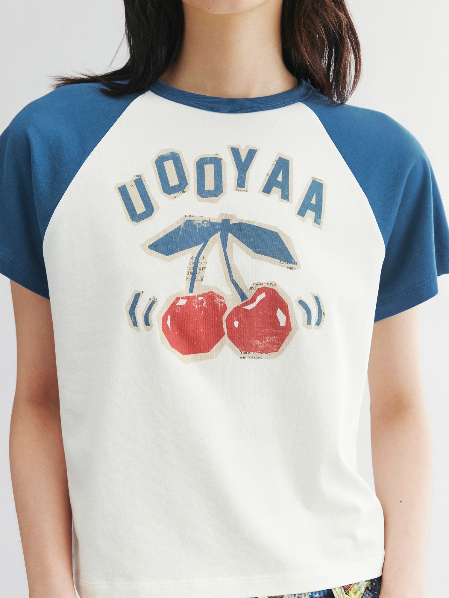 Raglan sleeve tee with dynamic cherry print