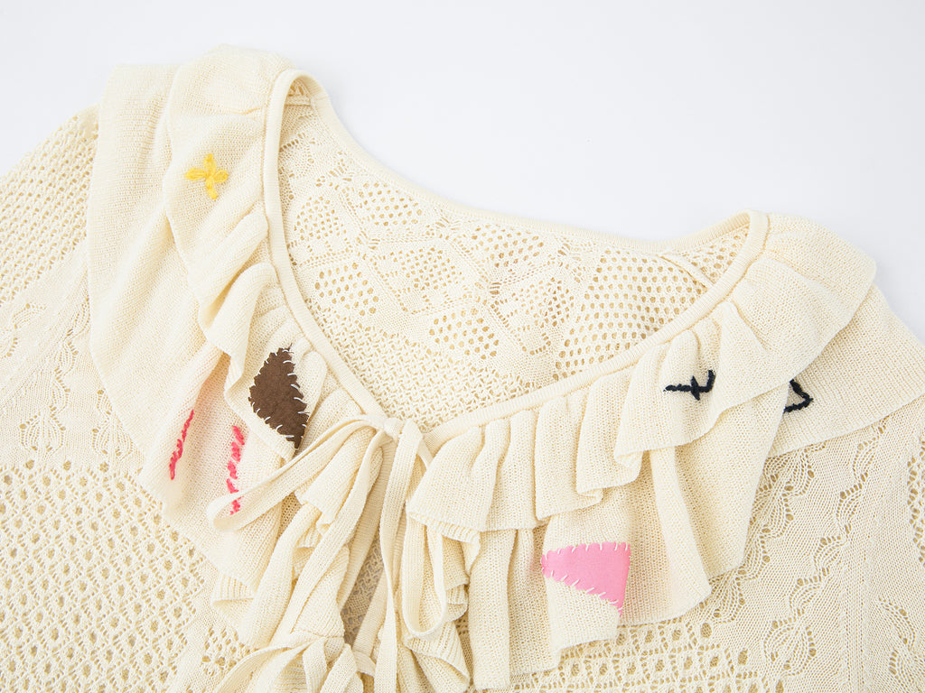 Handcrafted patch cardigan with ruffled edges