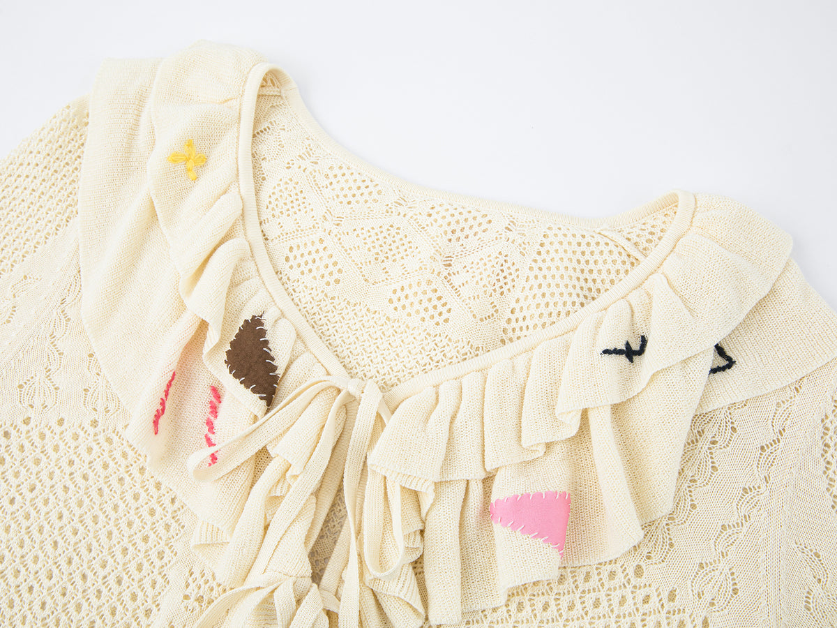 Handcrafted patch cardigan with ruffled edges