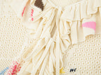 Handcrafted patch cardigan with ruffled edges