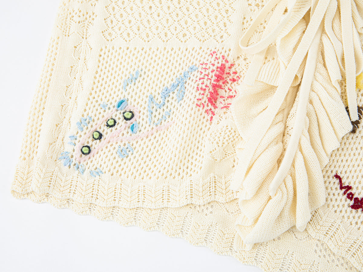 Handcrafted patch cardigan with ruffled edges