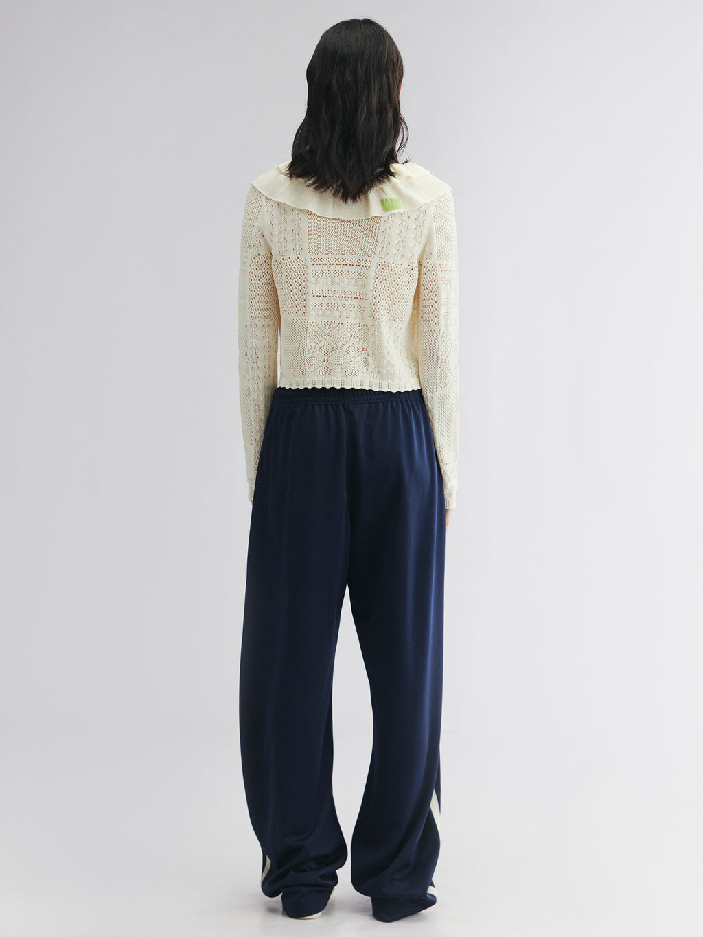 Handcrafted patch cardigan with ruffled edges
