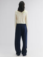 Handcrafted patch cardigan with ruffled edges