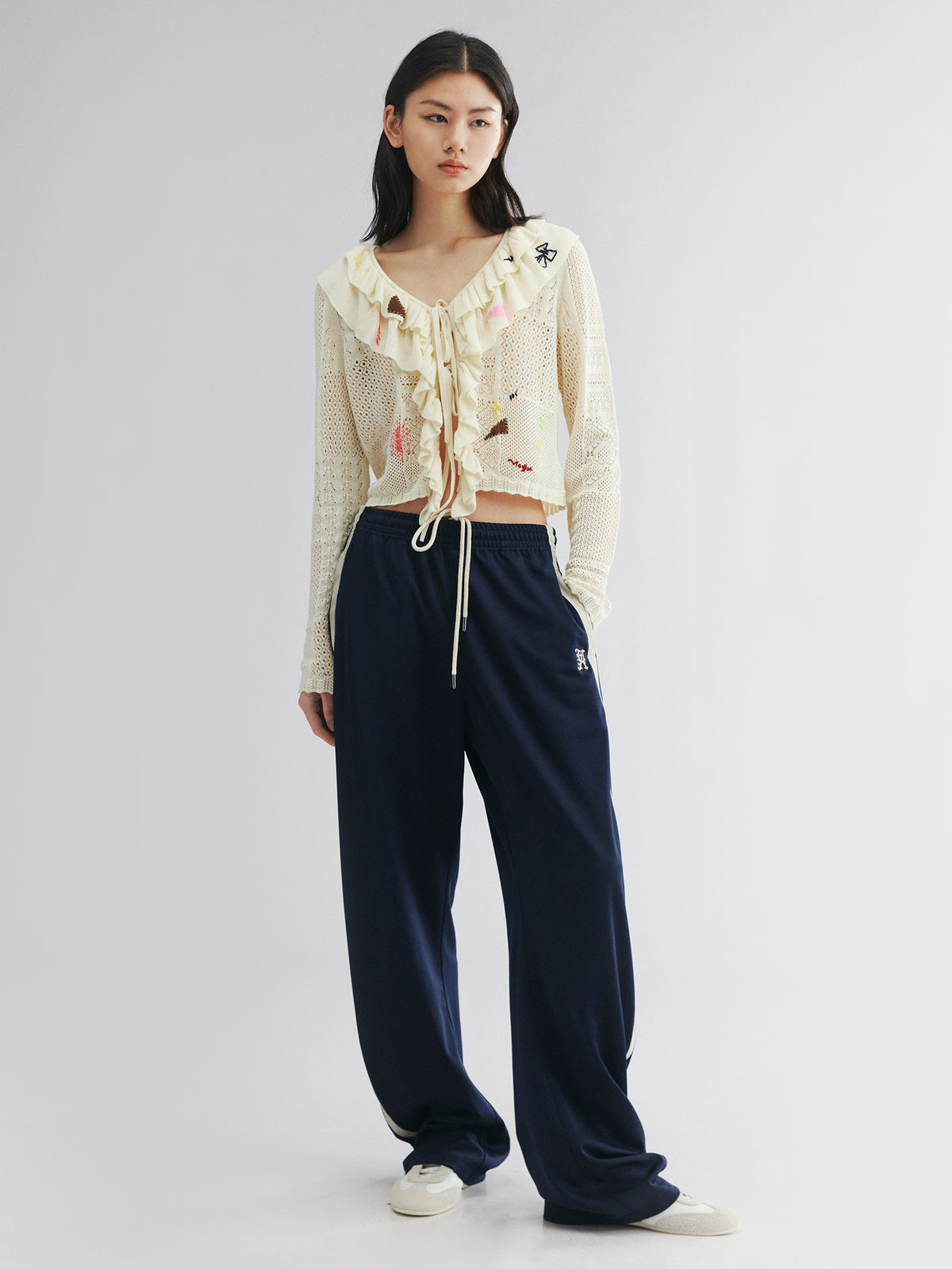 Handcrafted patch cardigan with ruffled edges
