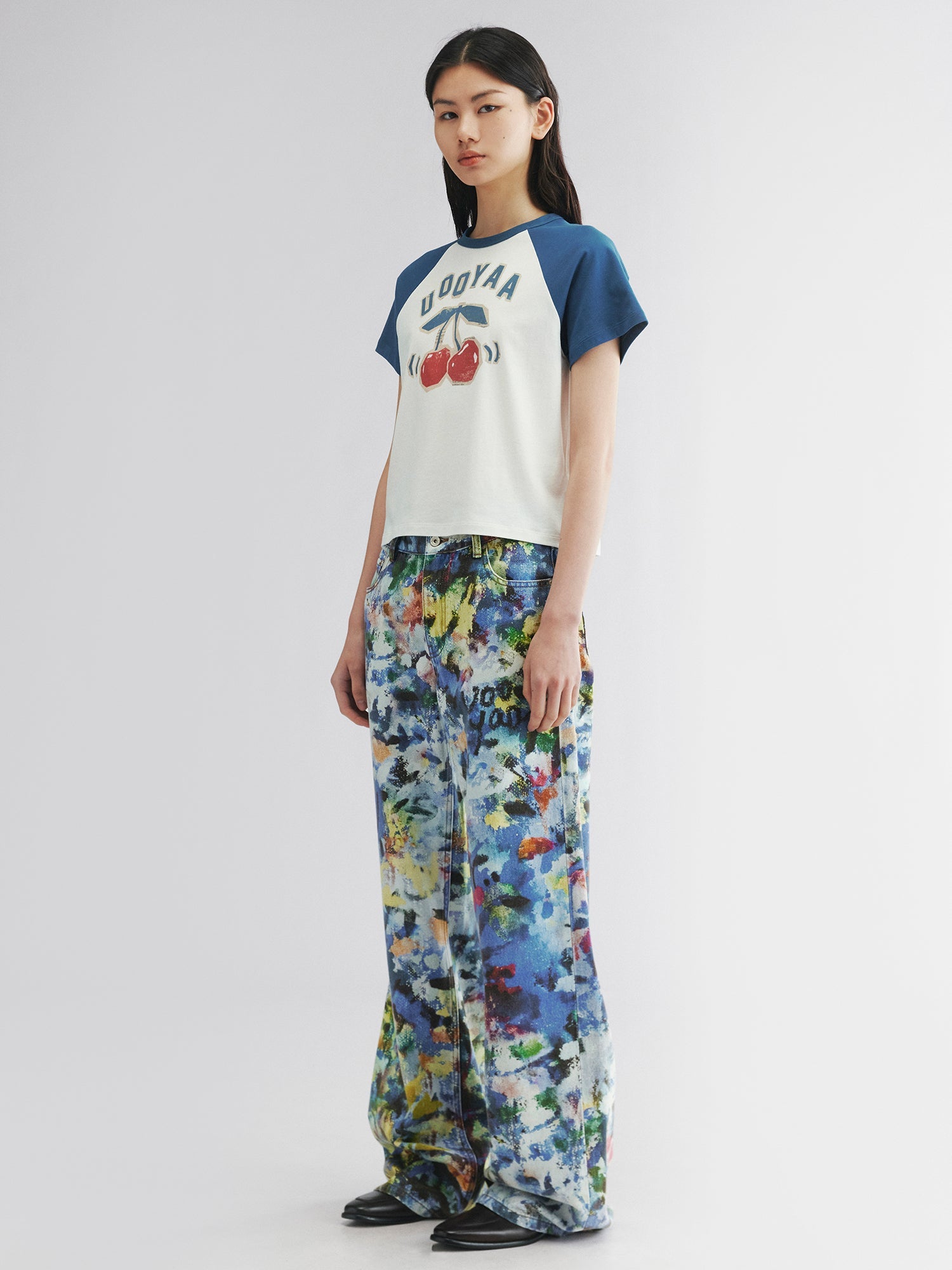 Graffiti-printed denim pants