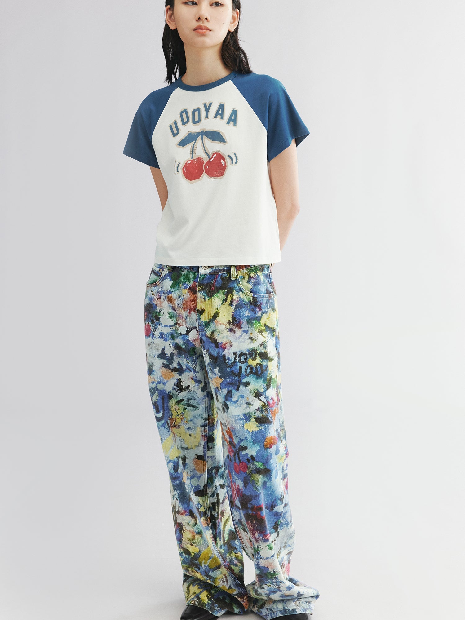 Graffiti-printed denim pants