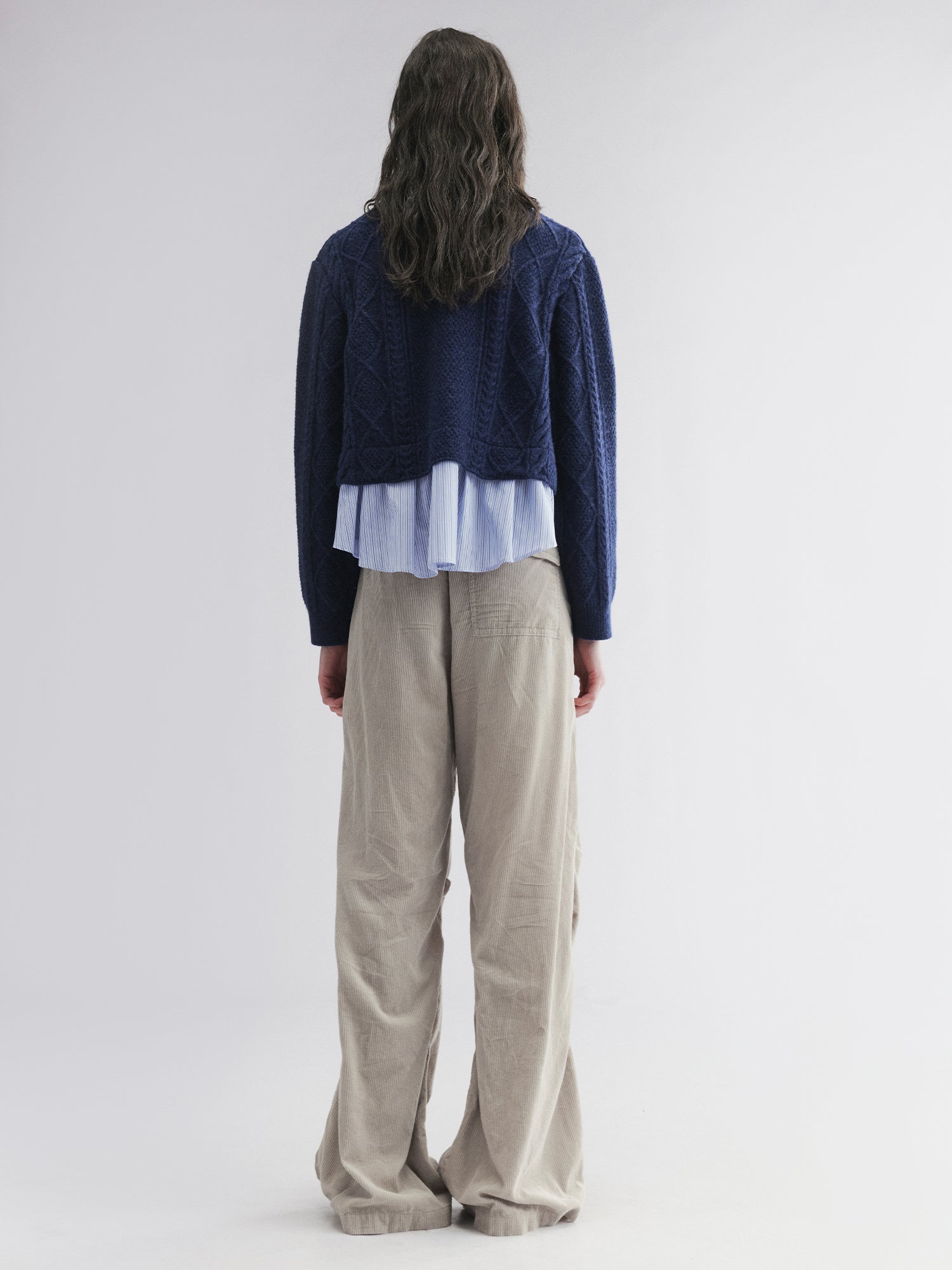 Pullover knit with layered shirt design