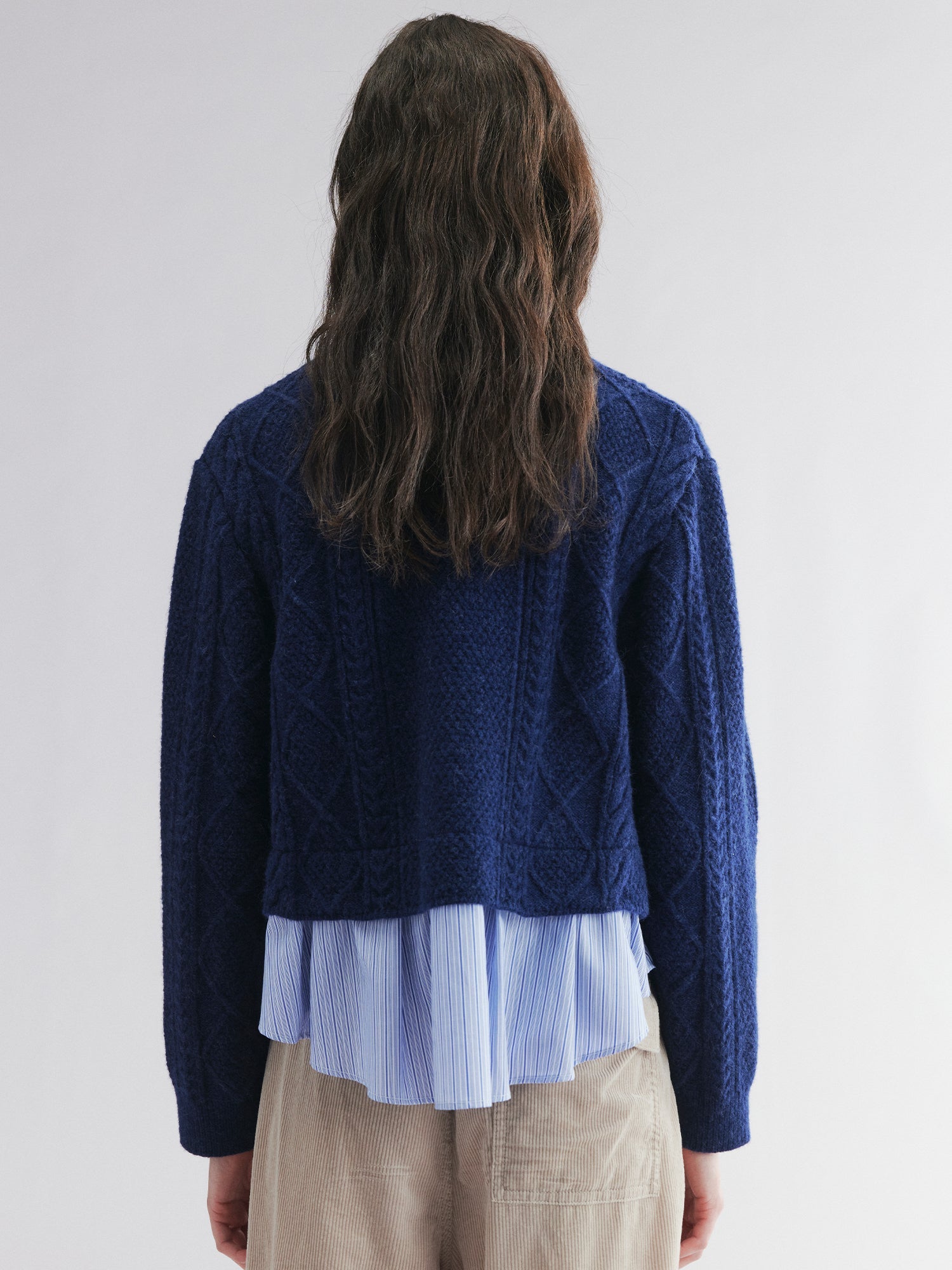 Pullover knit with layered shirt design