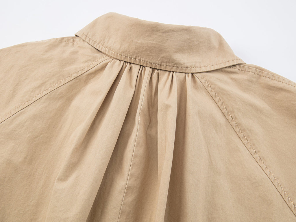 Exposed-lining balmacaan trench coat
