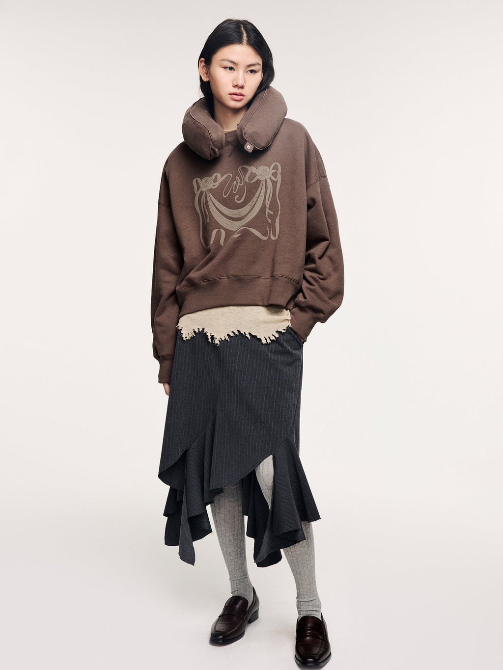 Hoodie with inflatable neck pillow detail