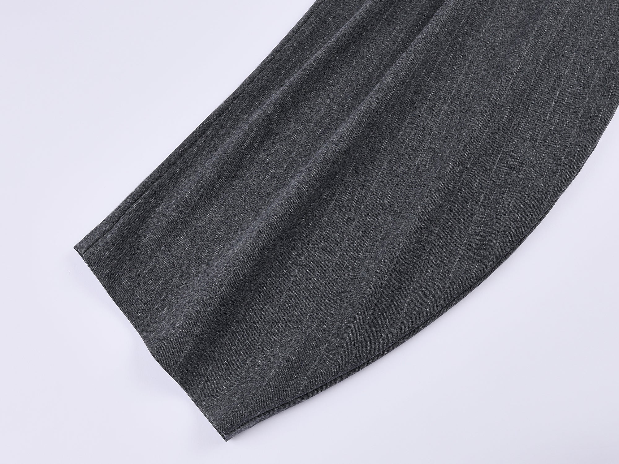 Draped tailored trousers with curved pleats