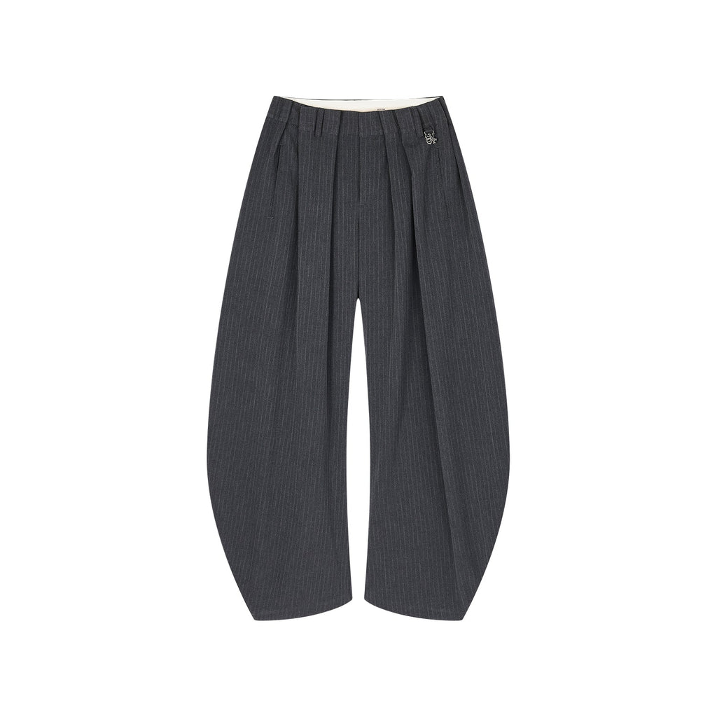 Draped tailored trousers with curved pleats