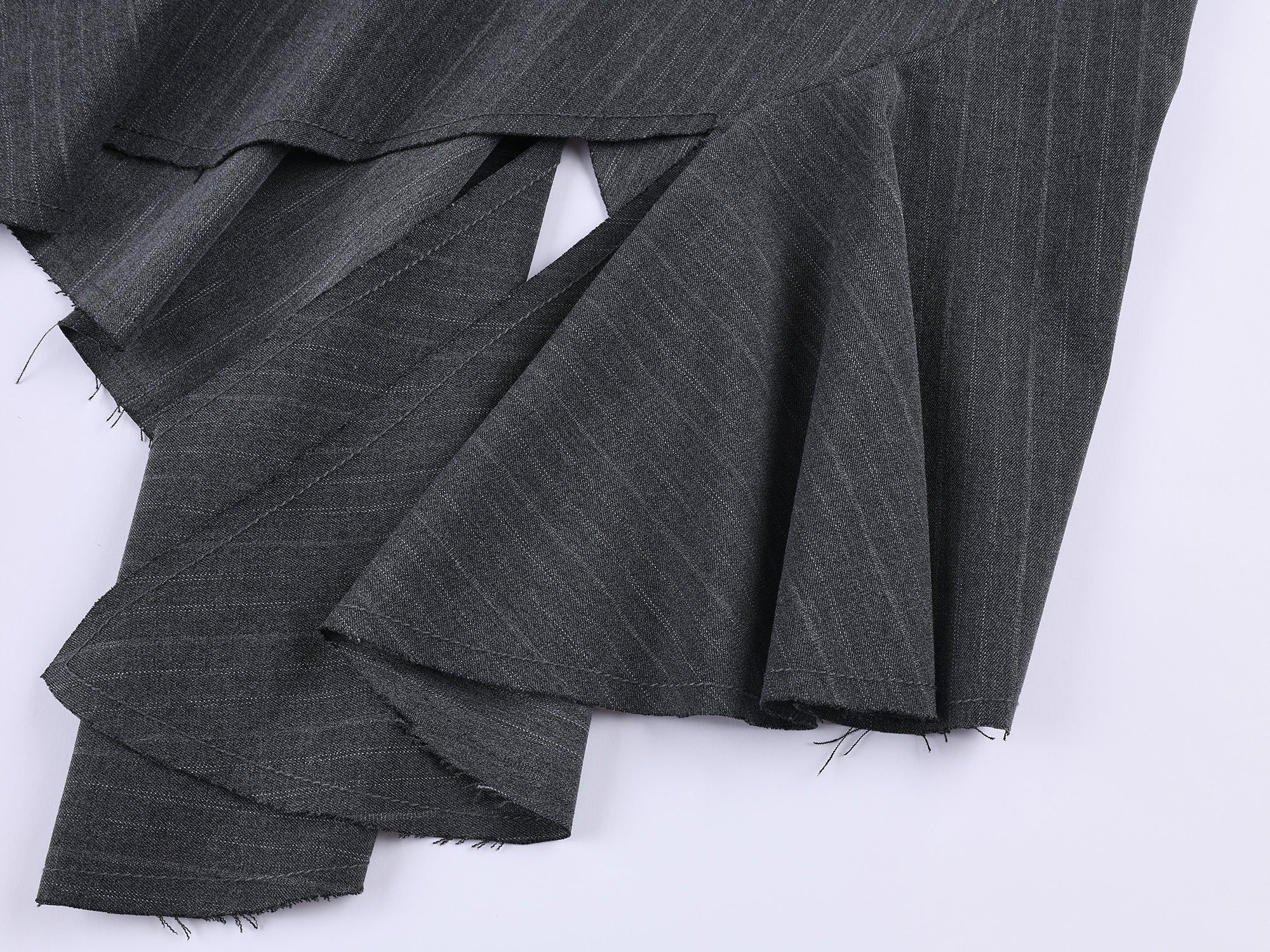 Tailored skirt with asymmetric ruffle trim