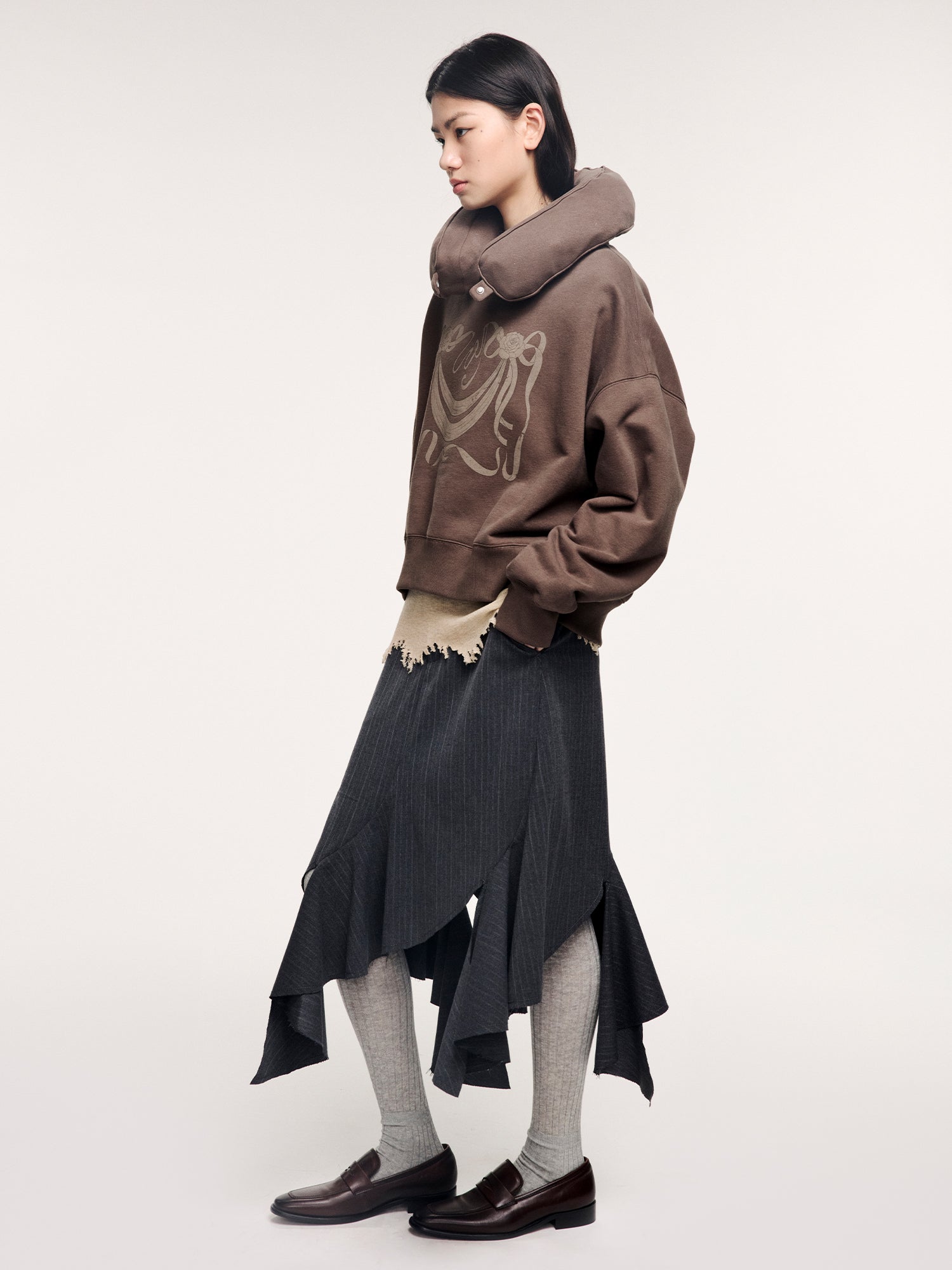 Tailored skirt with asymmetric ruffle trim