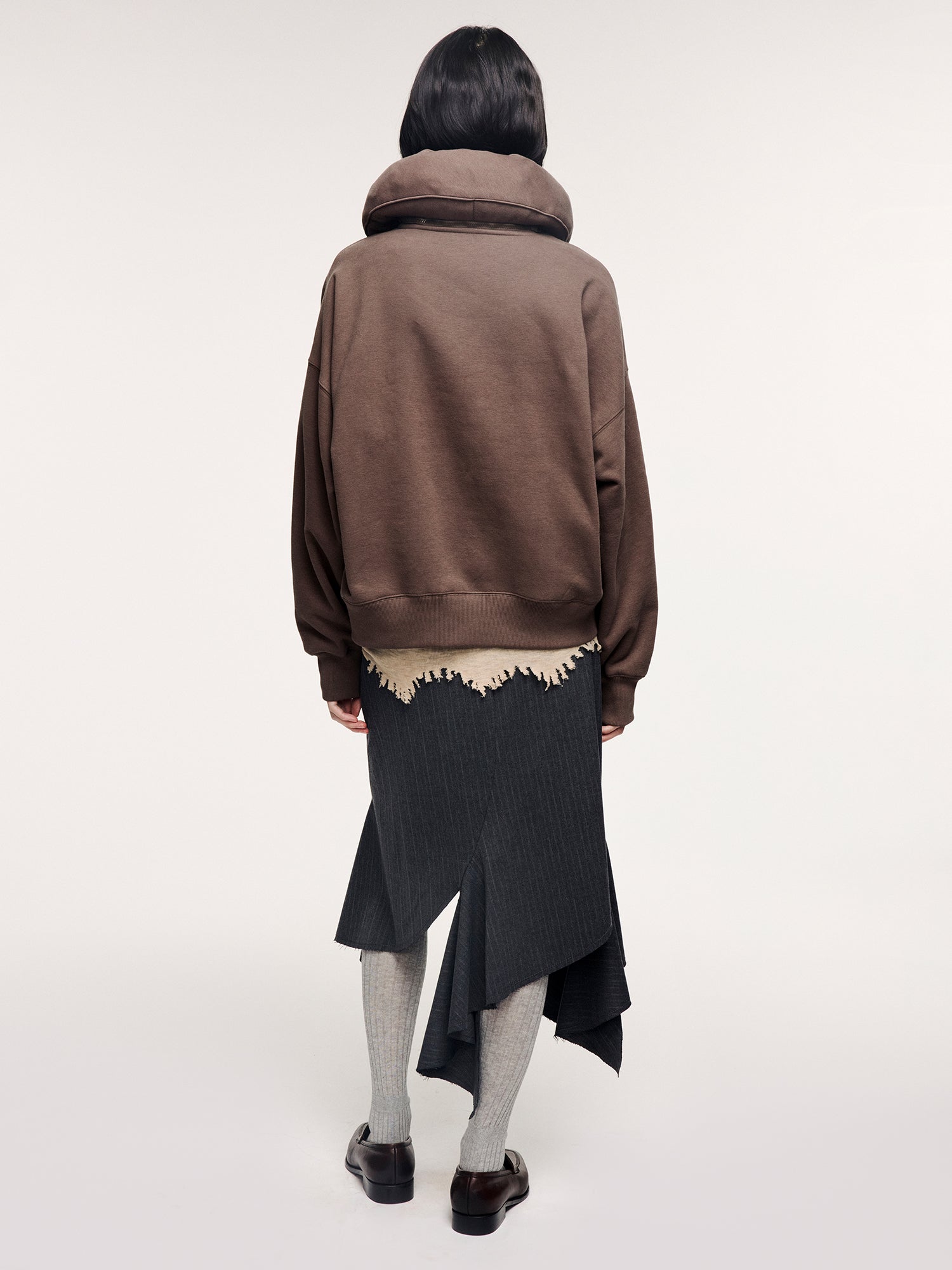 Tailored skirt with asymmetric ruffle trim