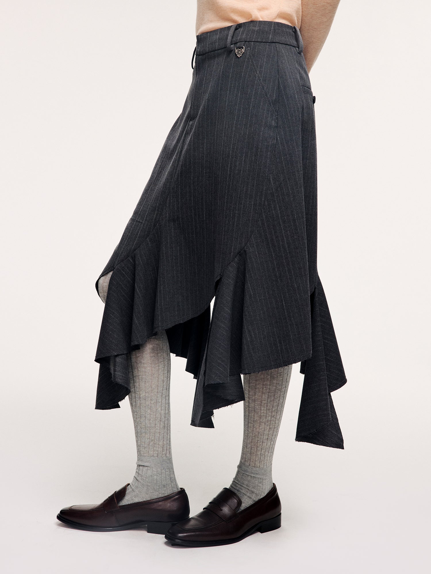 Tailored skirt with asymmetric ruffle trim