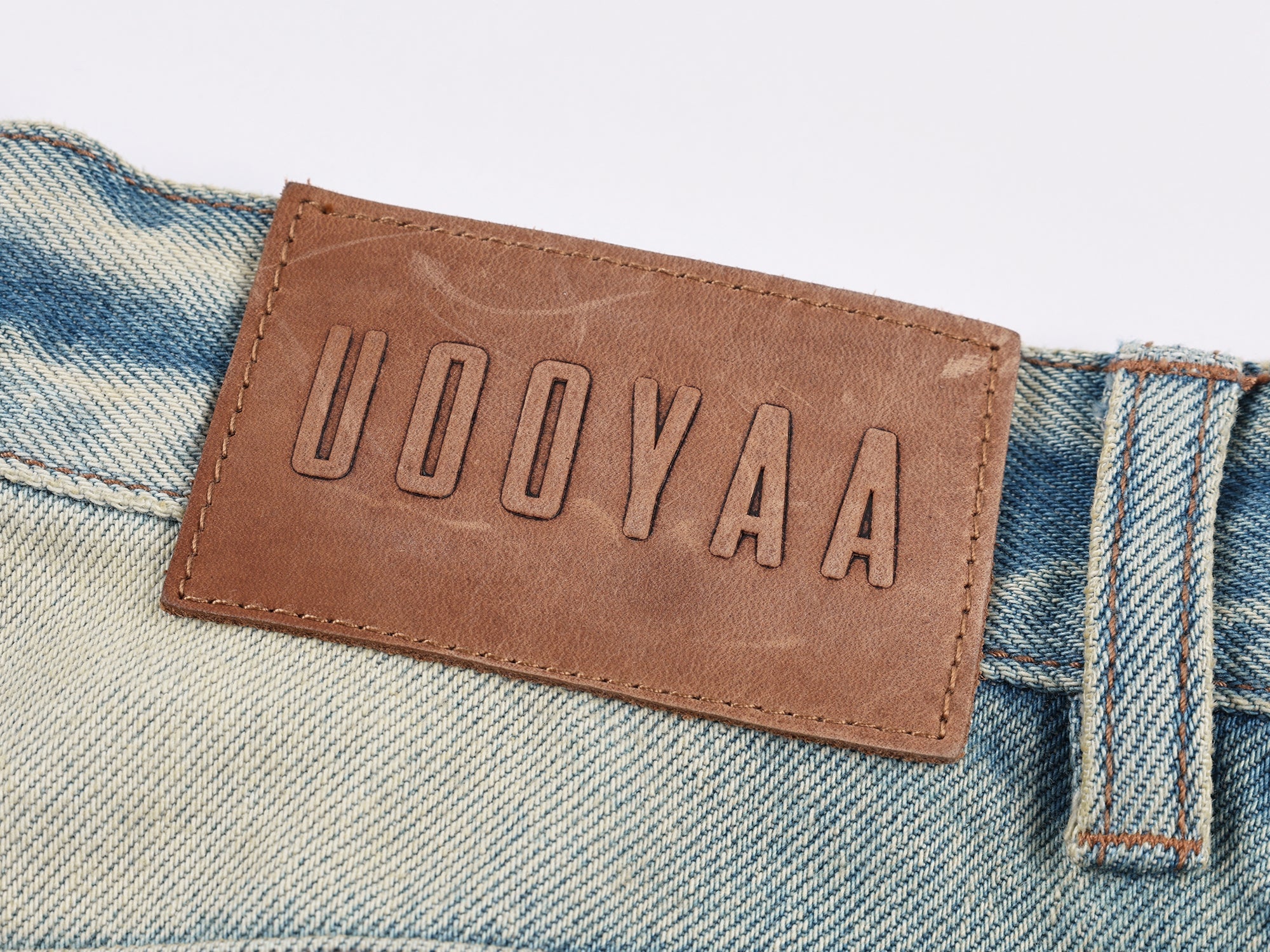 Pocket-flap washed denim jeans