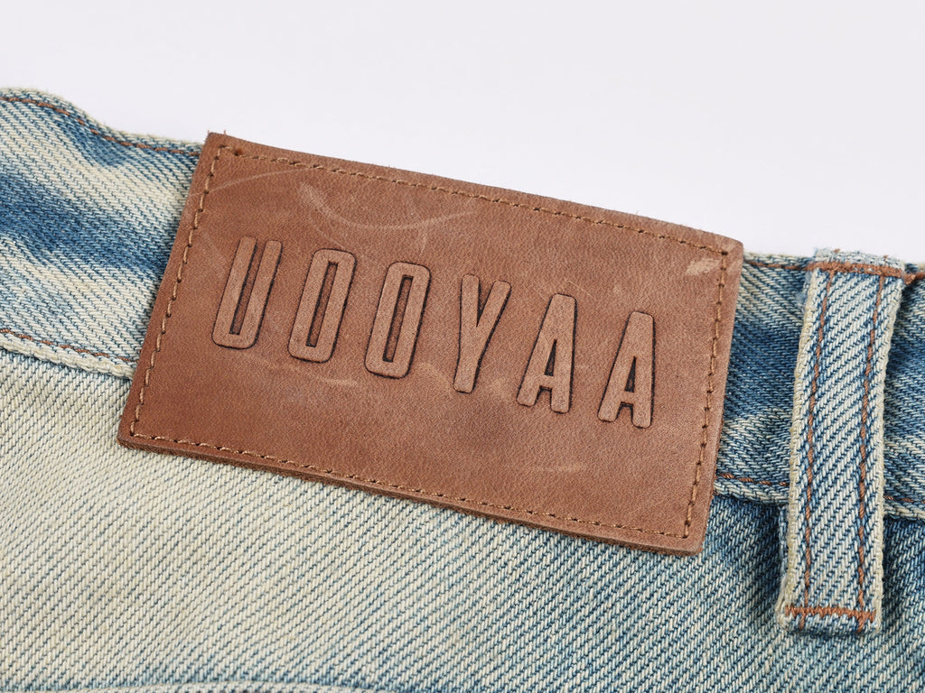 Pocket-flap washed denim jeans
