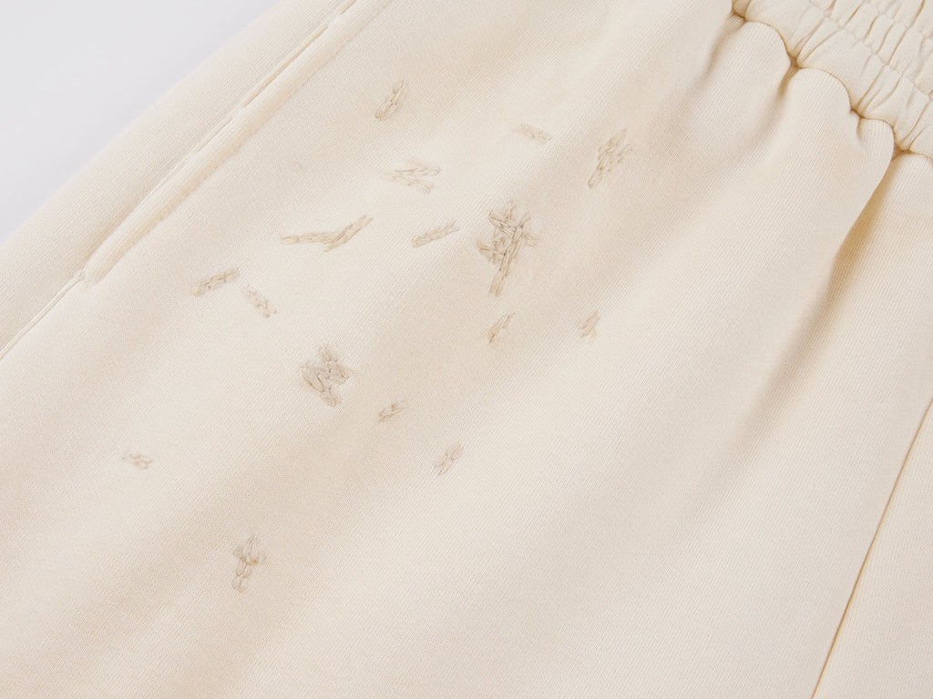 Distressed embroidered sweatpants