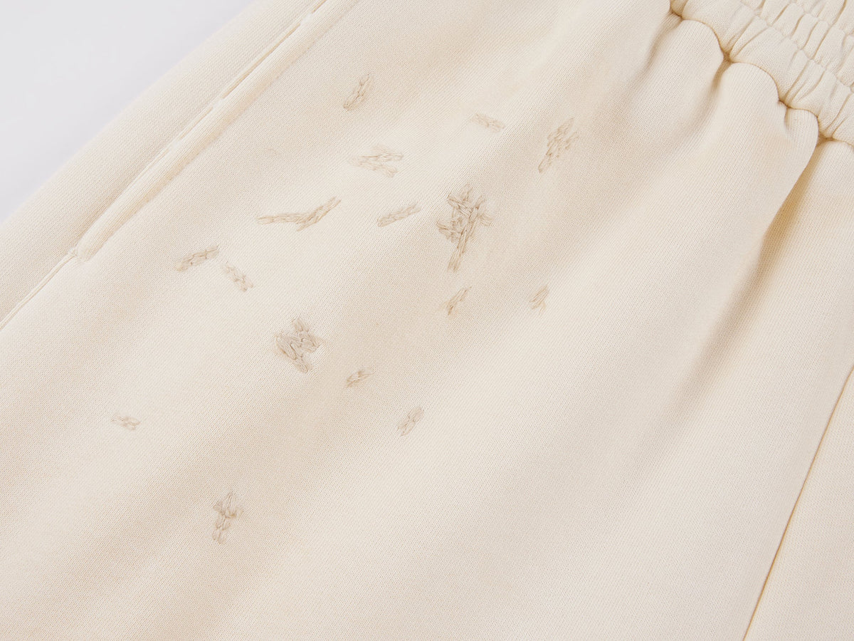 Distressed embroidered sweatpants
