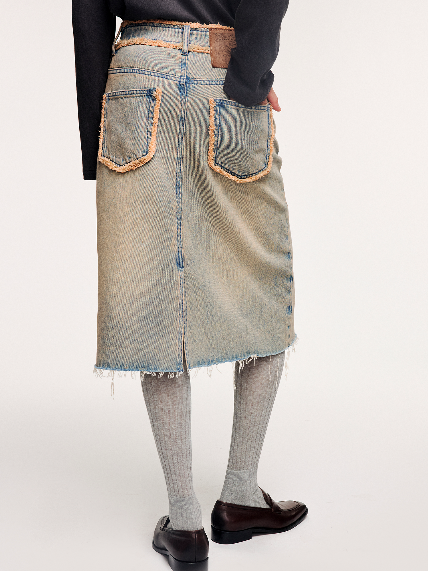 Washed raw-edge denim skirt