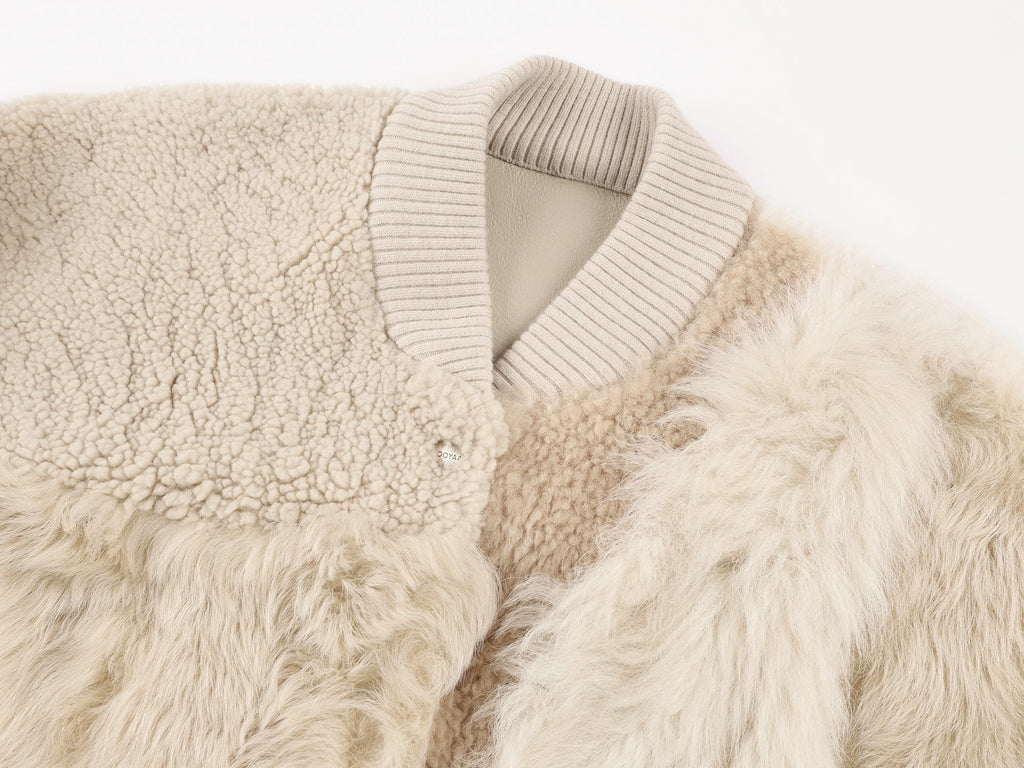 Reversible baseball jacket with shearling leather panels