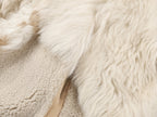 Reversible baseball jacket with shearling leather panels