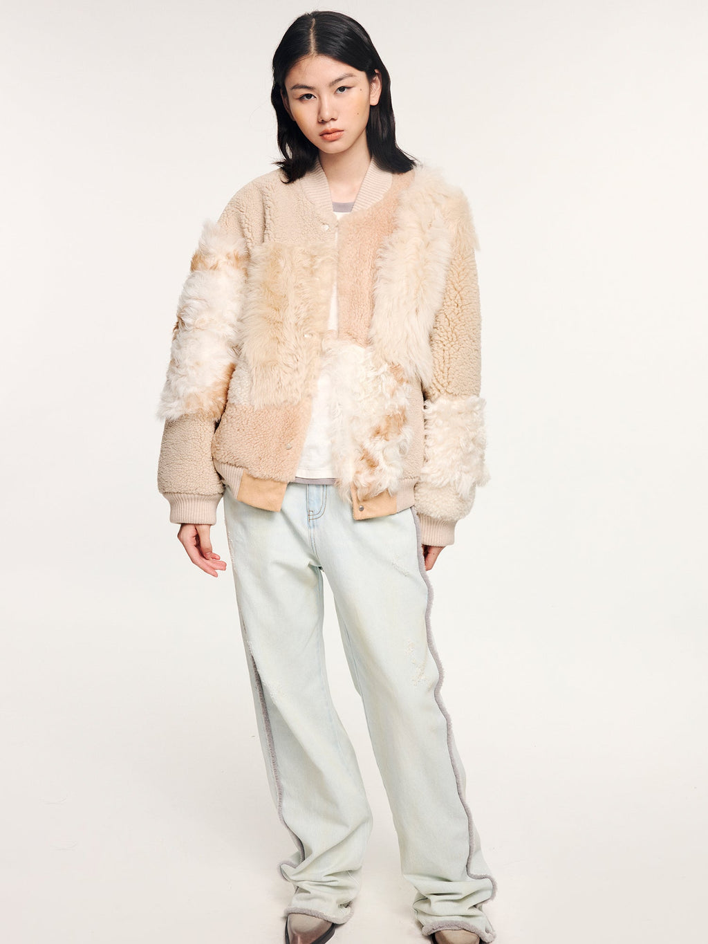 Reversible baseball jacket with shearling leather panels