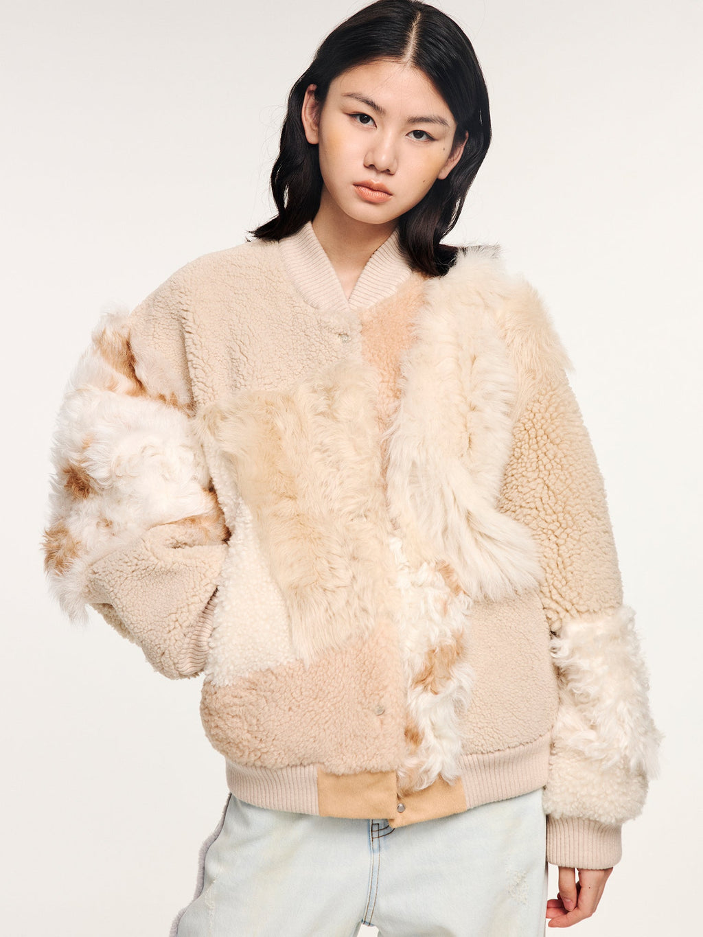 Reversible baseball jacket with shearling leather panels