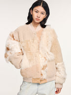 Reversible baseball jacket with shearling leather panels