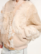 Reversible baseball jacket with shearling leather panels