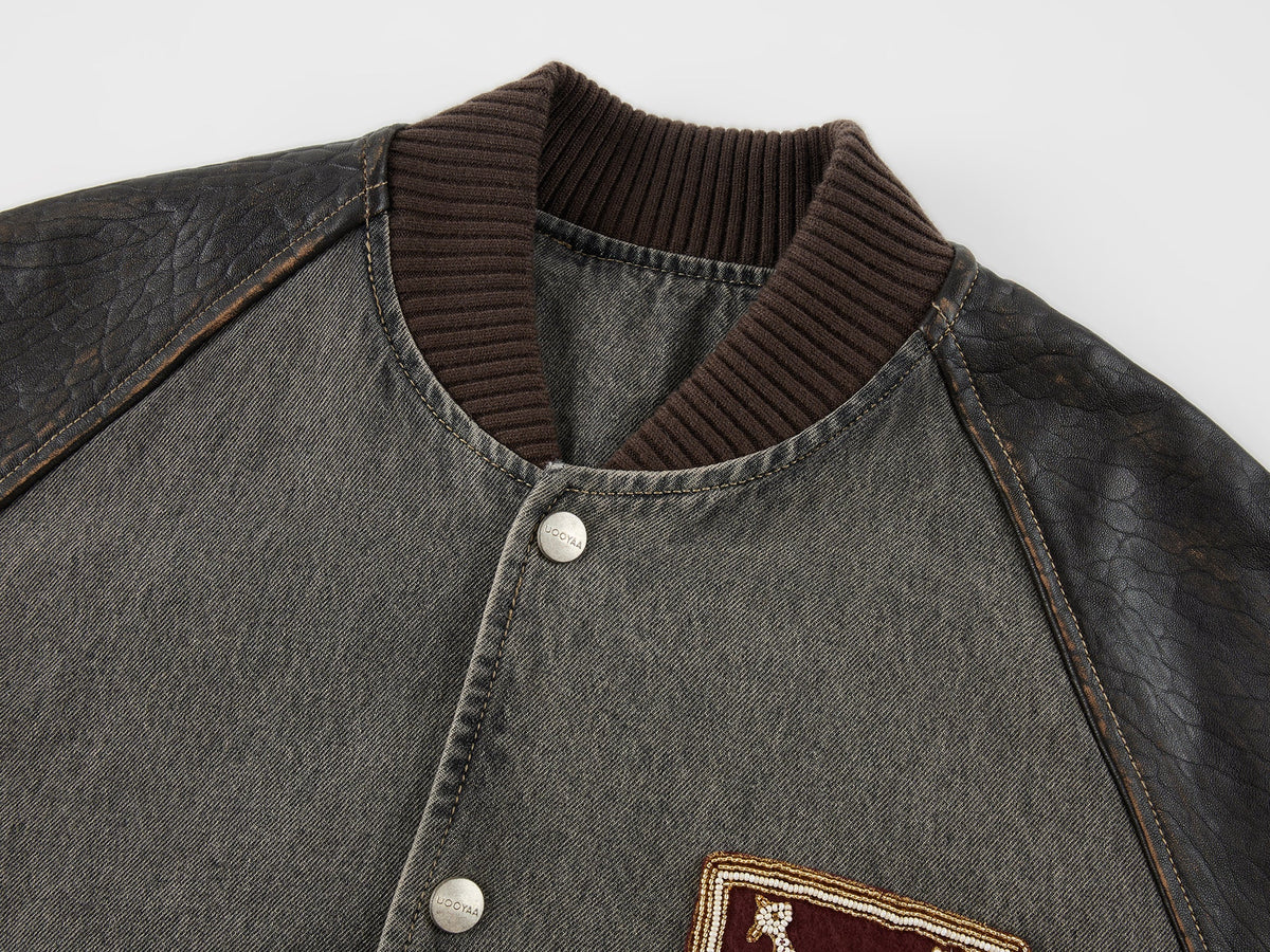 Baseball jacket with leather sleeves and badges