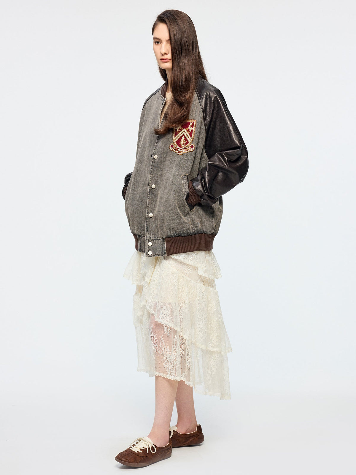 Baseball jacket with leather sleeves and badges
