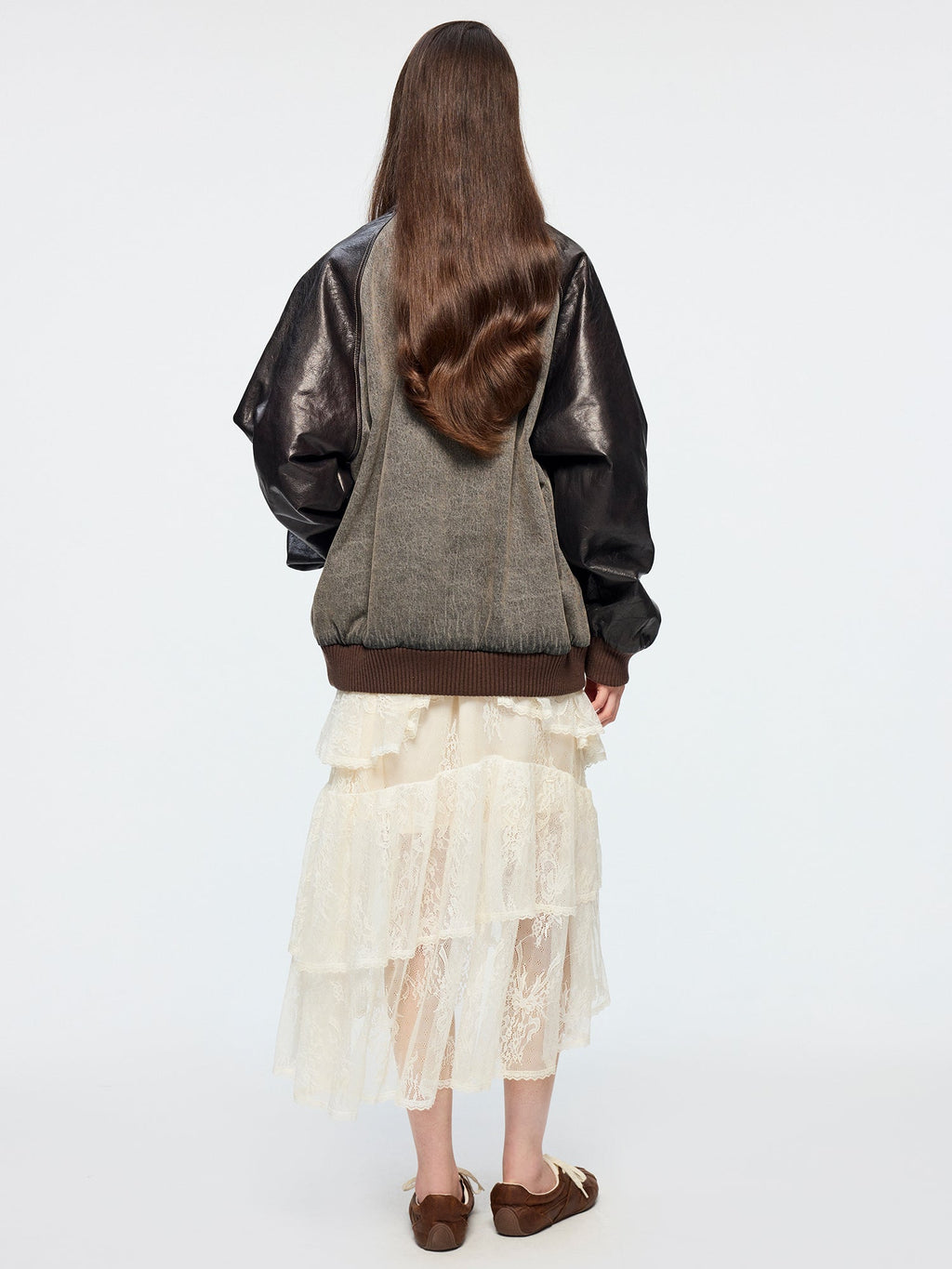 Baseball jacket with leather sleeves and badges