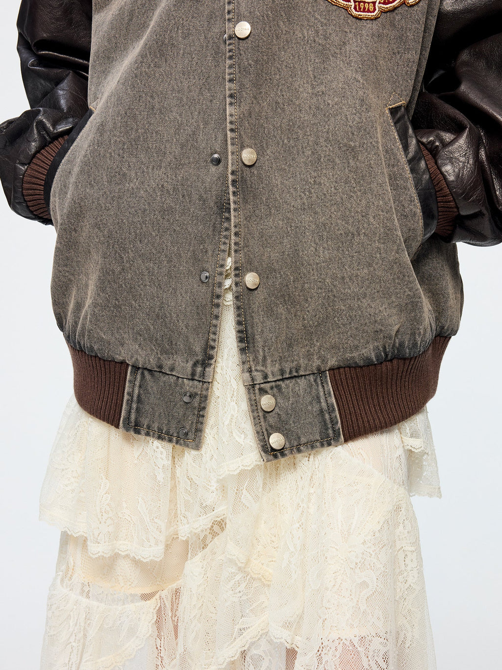 Baseball jacket with leather sleeves and badges
