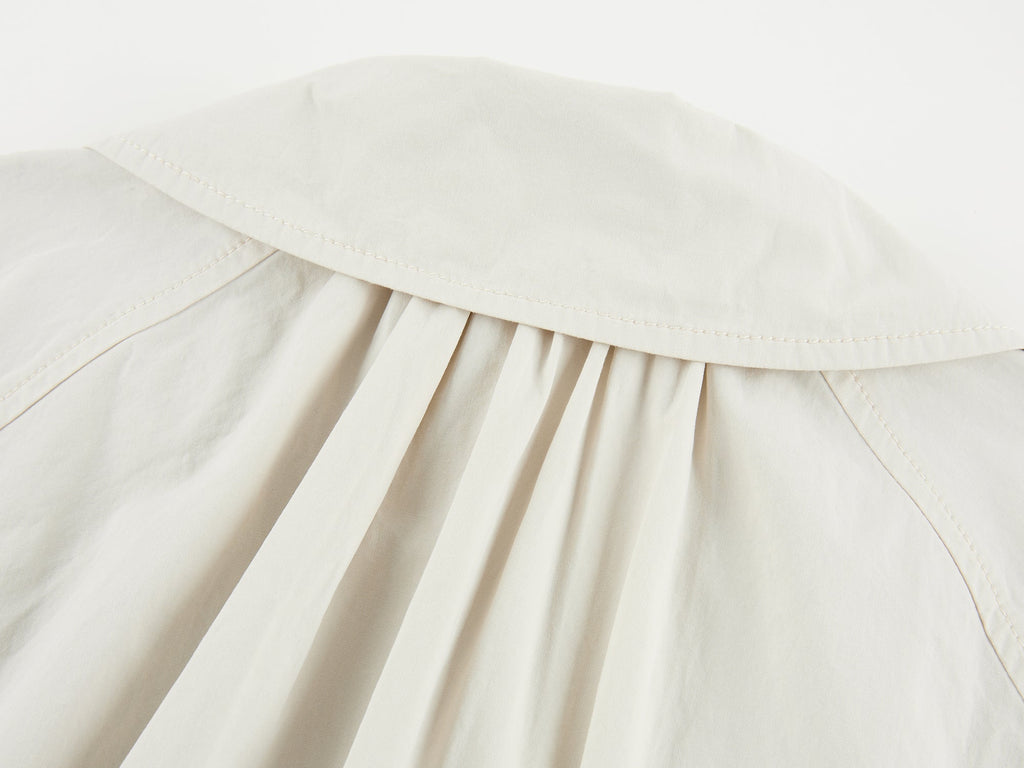 Exposed lining cropped balmacaan coat
